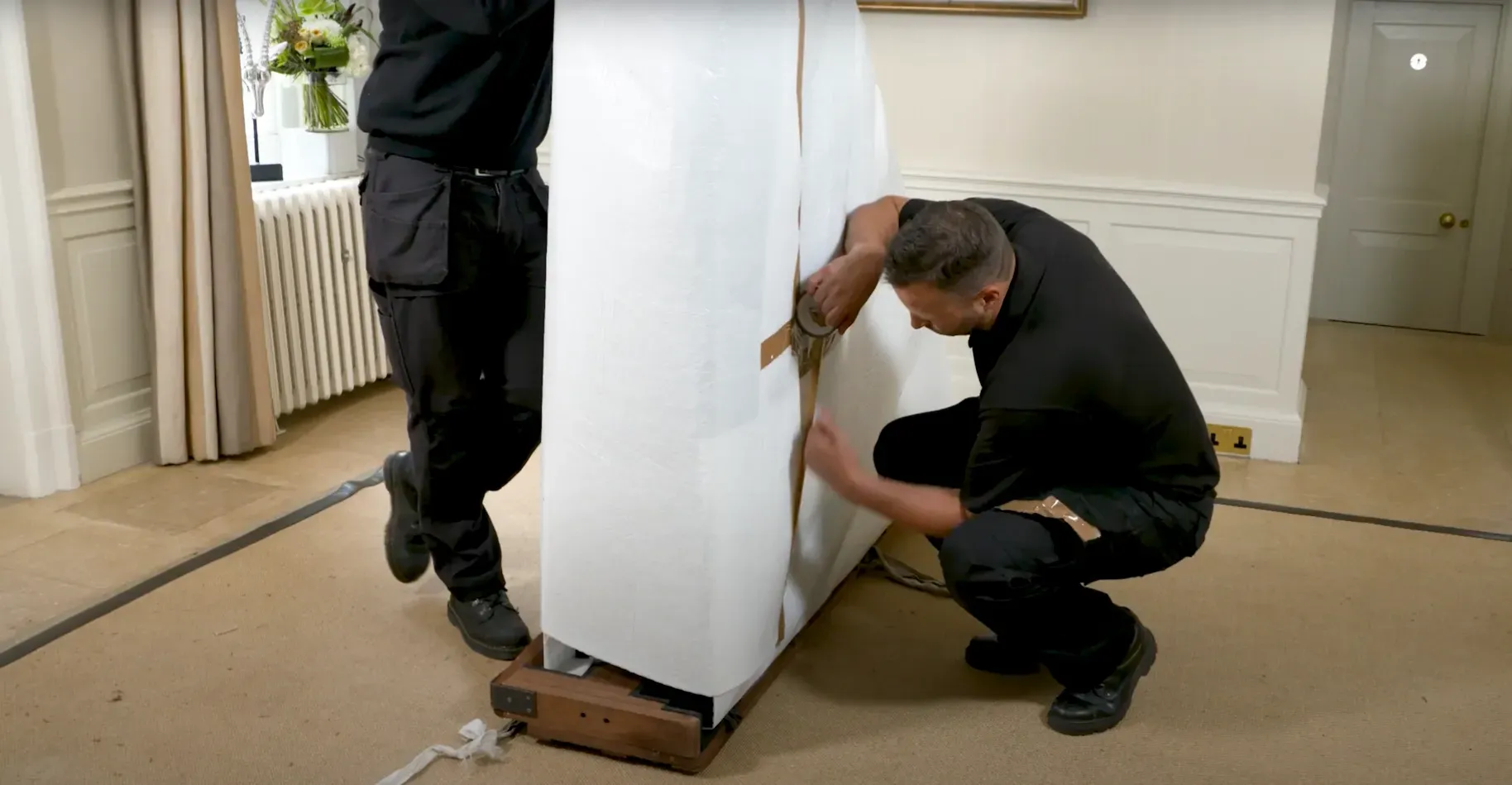 Professional movers carefully loading furniture